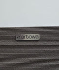 Textured surface with 'artowa' brand label