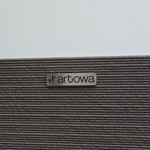Textured surface with 'artowa' brand label